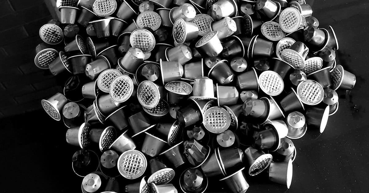 How Single-Use Coffee Capsules Are Destroying Our Planet 1 coffee pod waste black and white