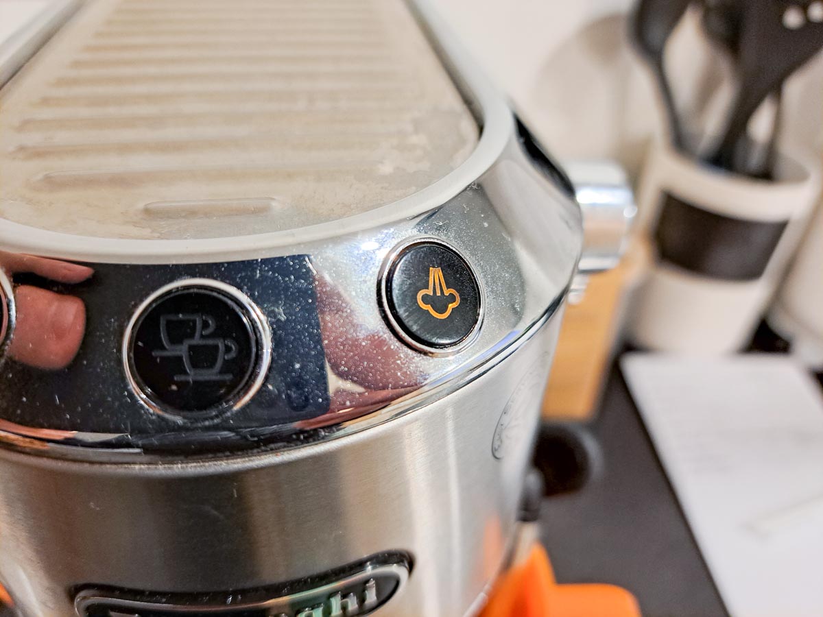 How To Descale Your Delonghi Dedica Machine (3 Simple Steps) 14 orange descaling light on dedica machine