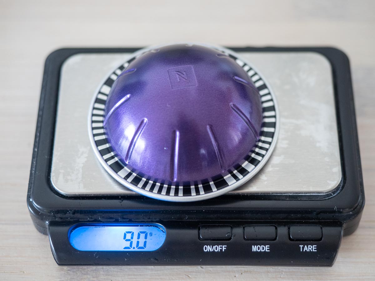 Nespresso Altissio Review and Key Info (Read Before Buying) 3 Nespresso altissio weight altissio capsule being weighted on a set of scales